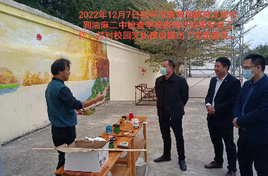  桂平市艺术学校美术教师到油麻二中绘制艺术墙活动